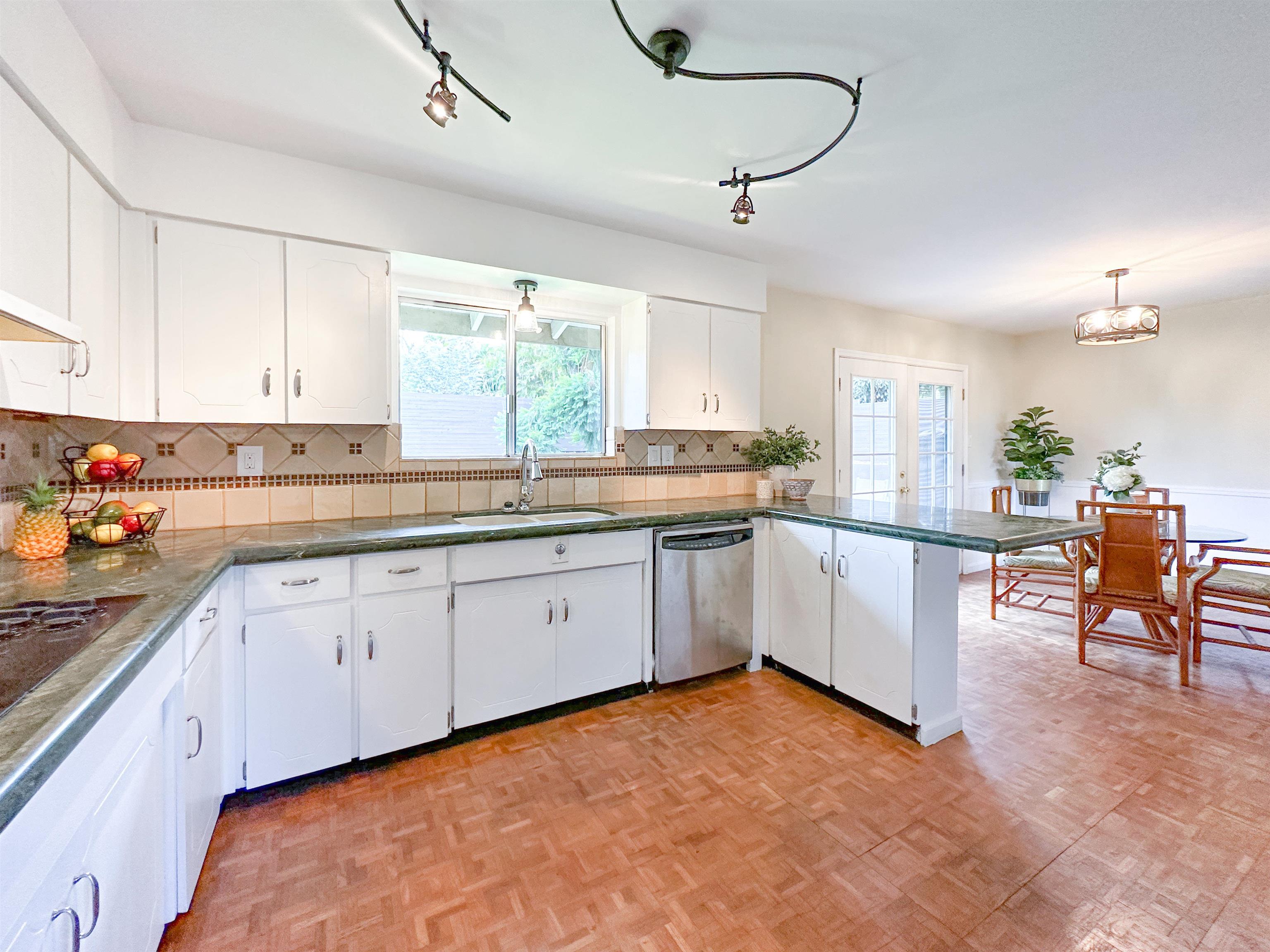 1875 Lower Kula Road Kula, HI 96790 - Photo 5 of 36 a large white kitchen with a window