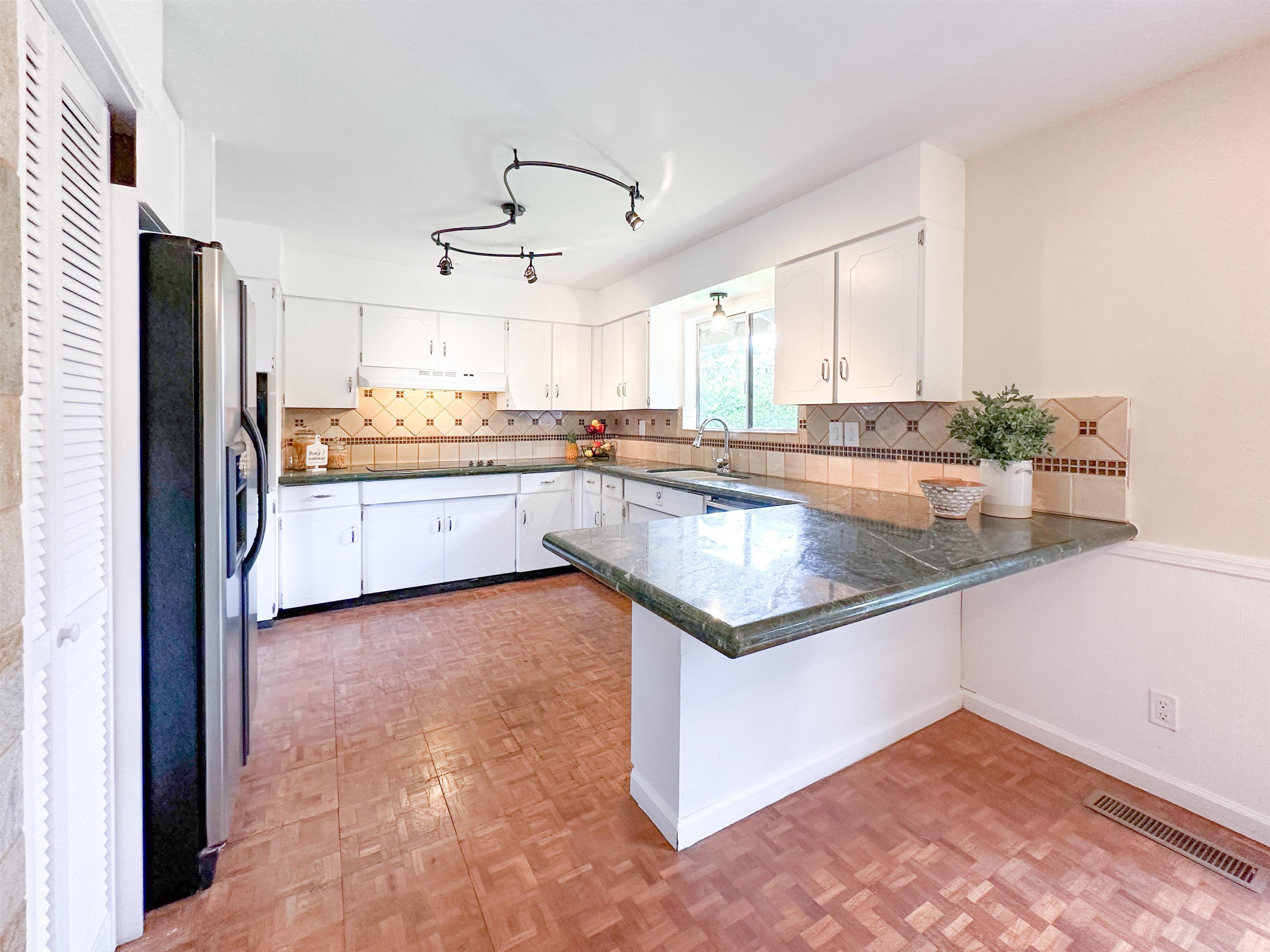 1875 Lower Kula Road Kula, HI 96790 - Photo 6 of 36 a kitchen with stainless steel appliances granite countertop a sink and a stove