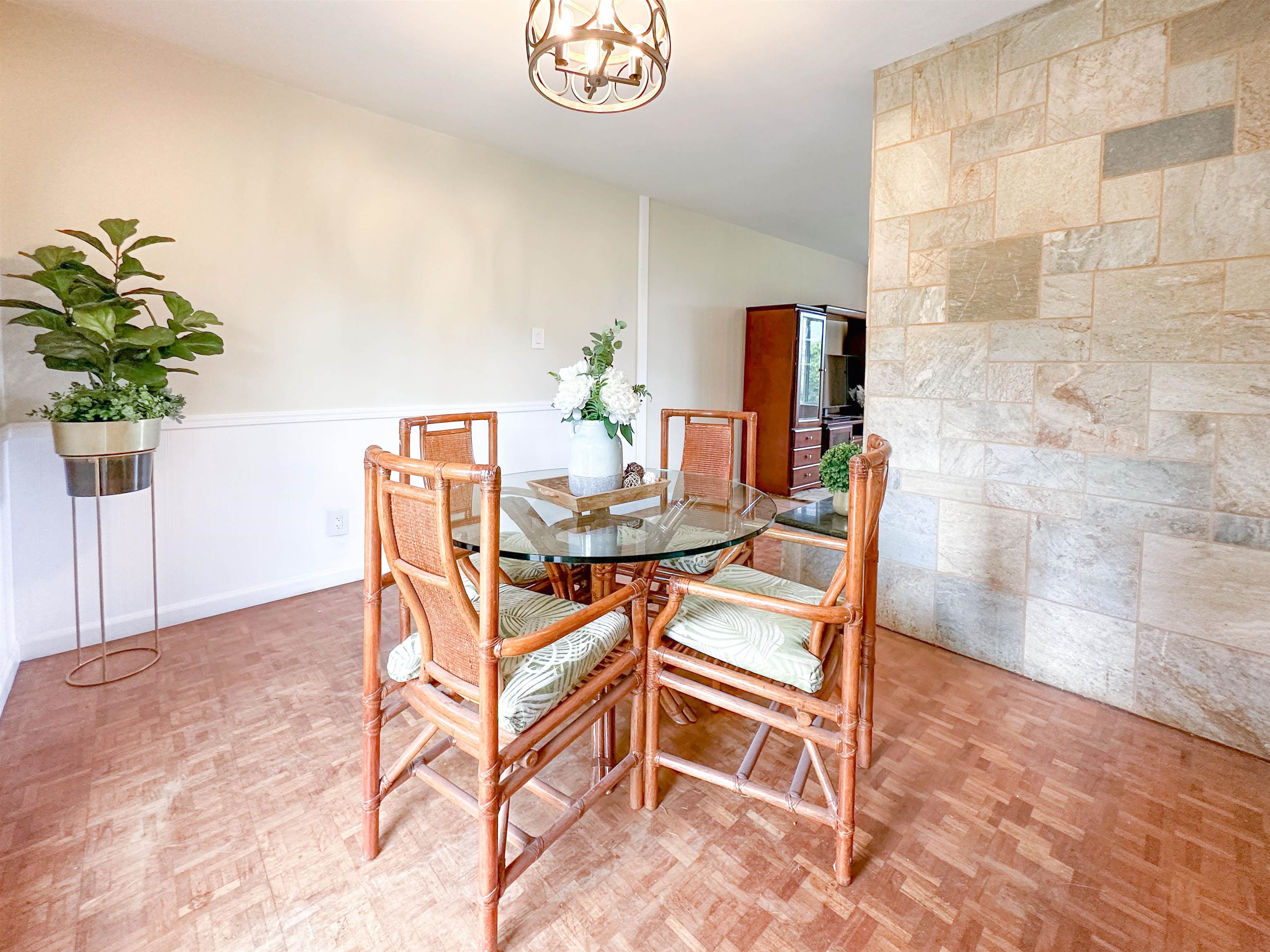 1875 Lower Kula Road Kula, HI 96790 - Photo 8 of 36 a dining room with furniture and a potted plant