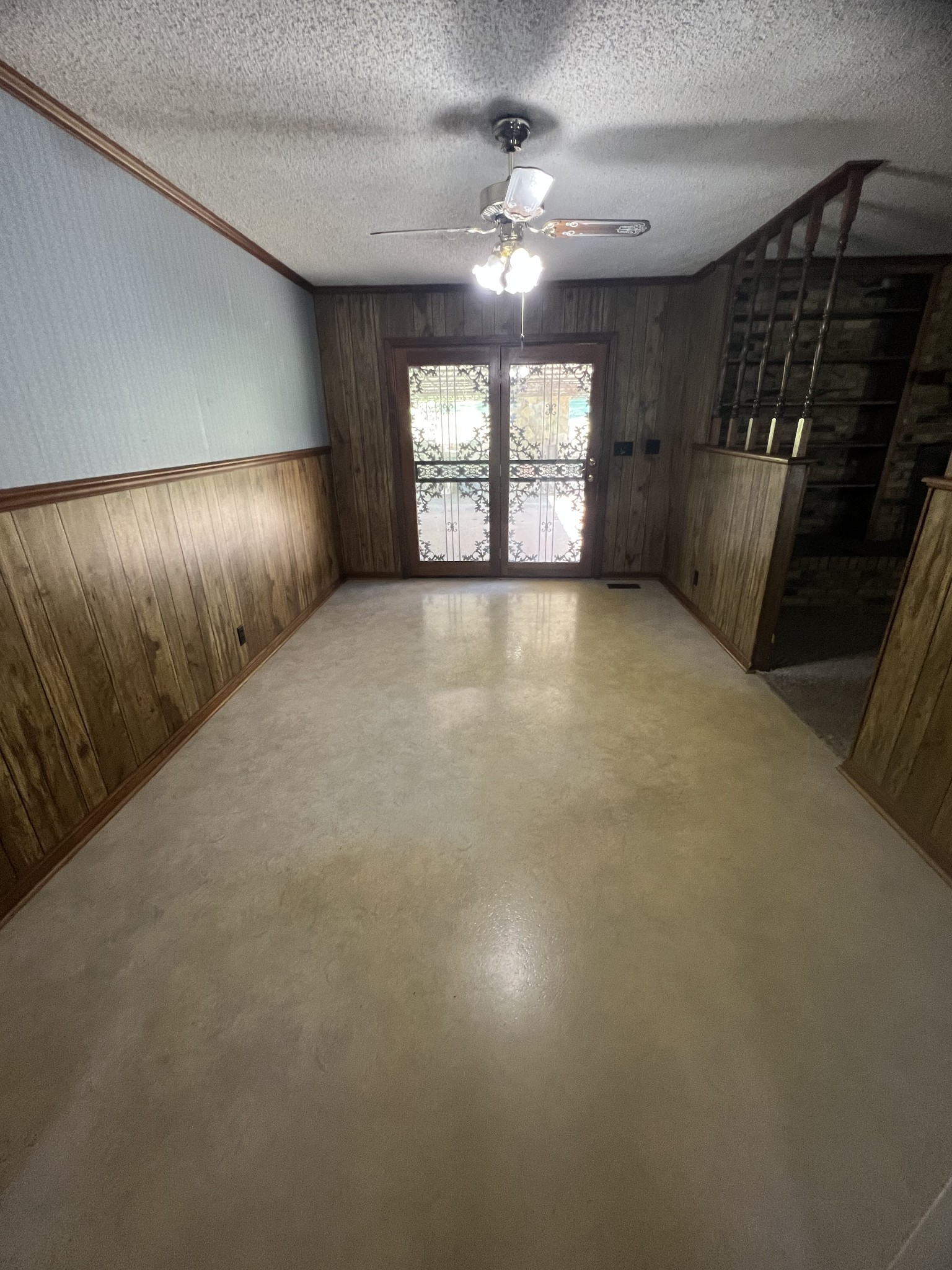 170 Turkey Creek Road Carthage, TN 37030 - Photo 11 of 23 en empty room with windows and chandelier fan