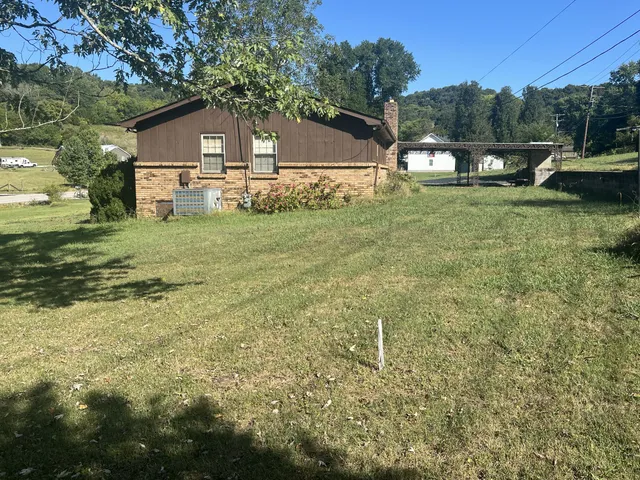 a kitchen with stainless steel appliances a refrigerator a sink a stove a microwave and cabinets