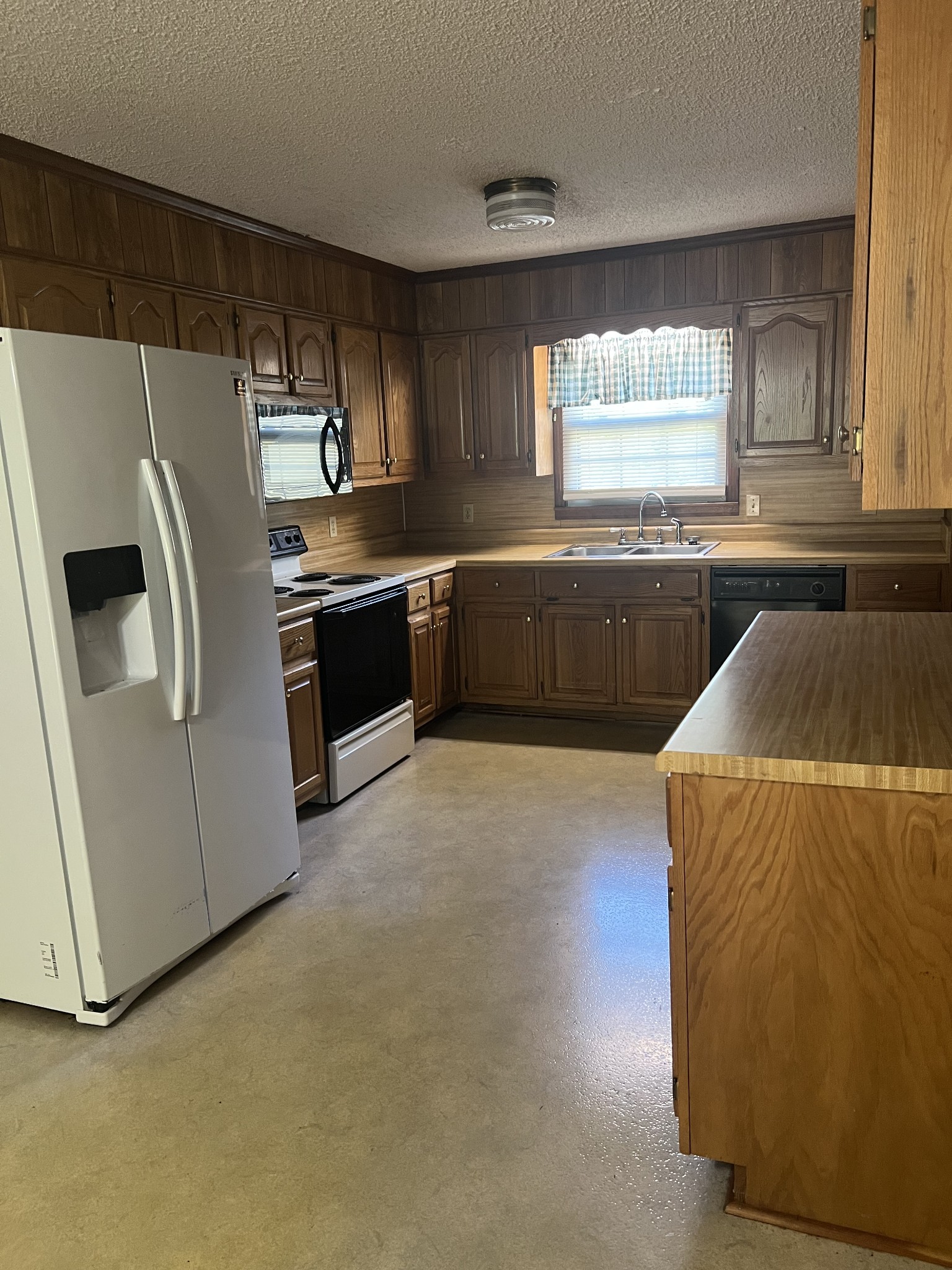 170 Turkey Creek Road Carthage, TN 37030 - Photo 8 of 23 a kitchen with a refrigerator and a sink