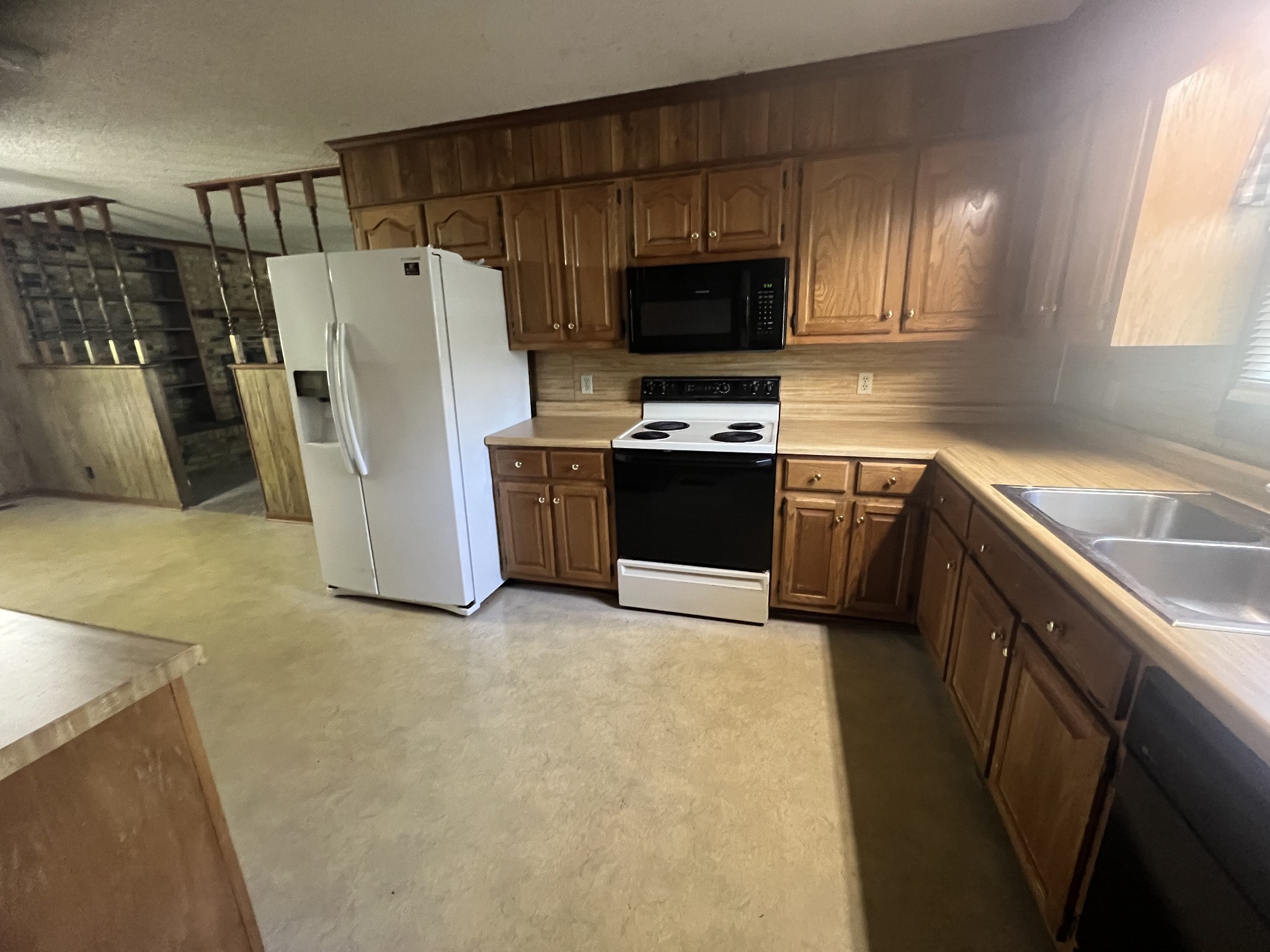 170 Turkey Creek Road Carthage, TN 37030 - Photo 9 of 23 a kitchen with stainless steel appliances a refrigerator a sink a stove a microwave and cabinets