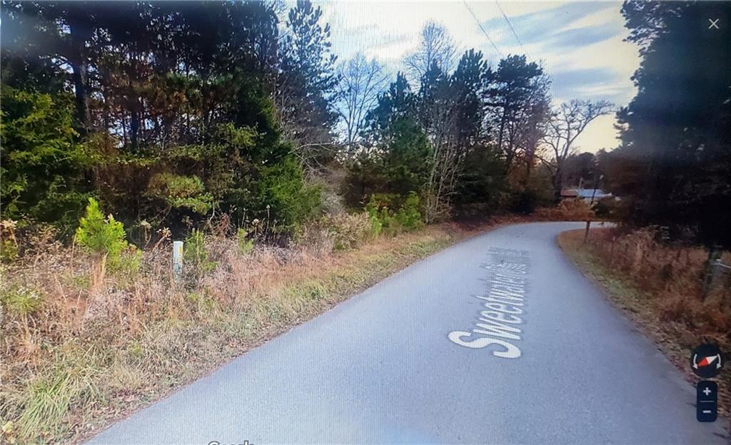 0 Sweetwater Church Road Dawsonville, GA 30534 - Photo 6 of 9 a view of a street with trees on both side of it