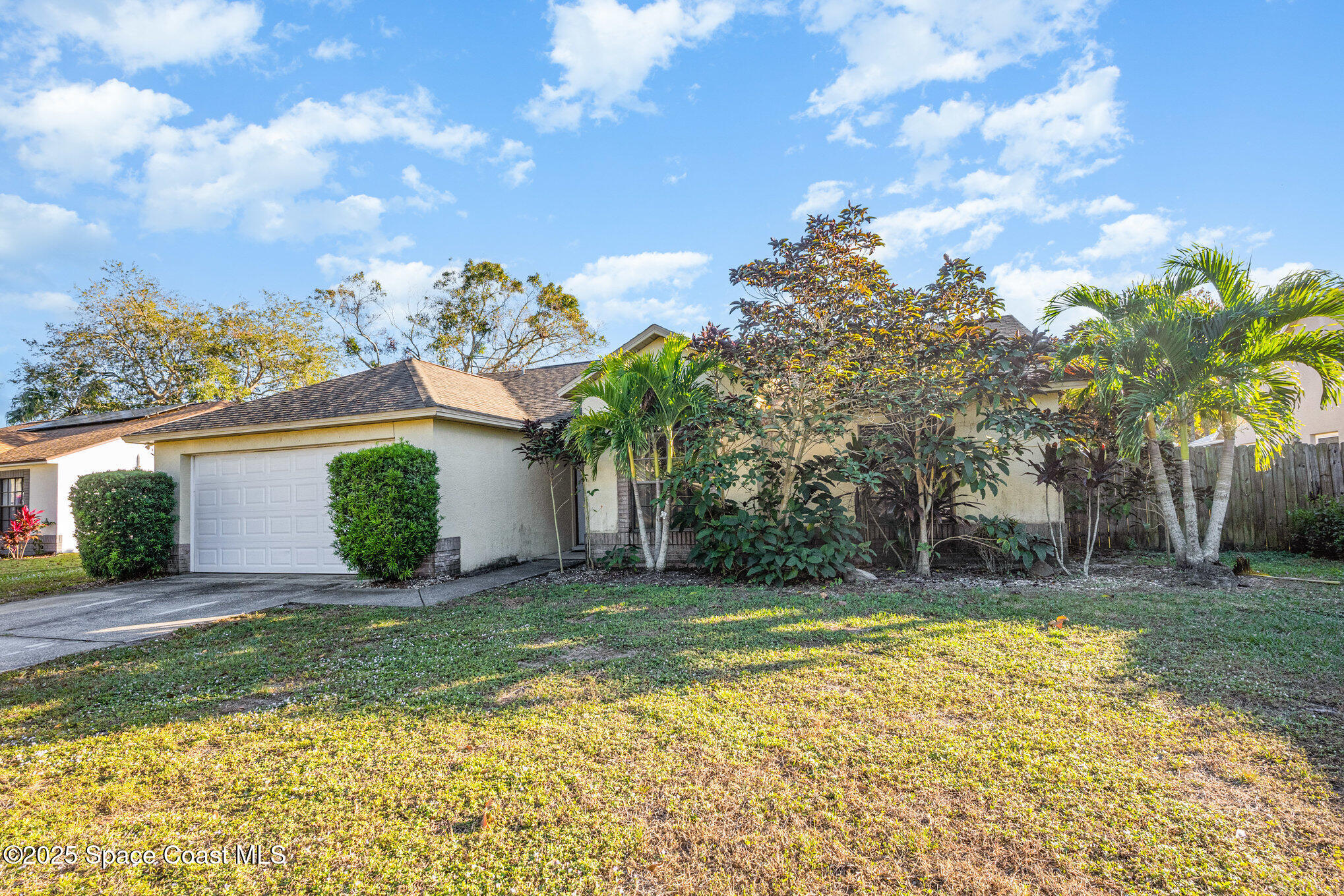 a view of a house with swimming pool and a yard