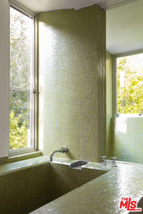2244 Mandeville Canyon Road Los Angeles, CA 90049 - Photo 29 of 50 a bathroom with a bathtub and shower
