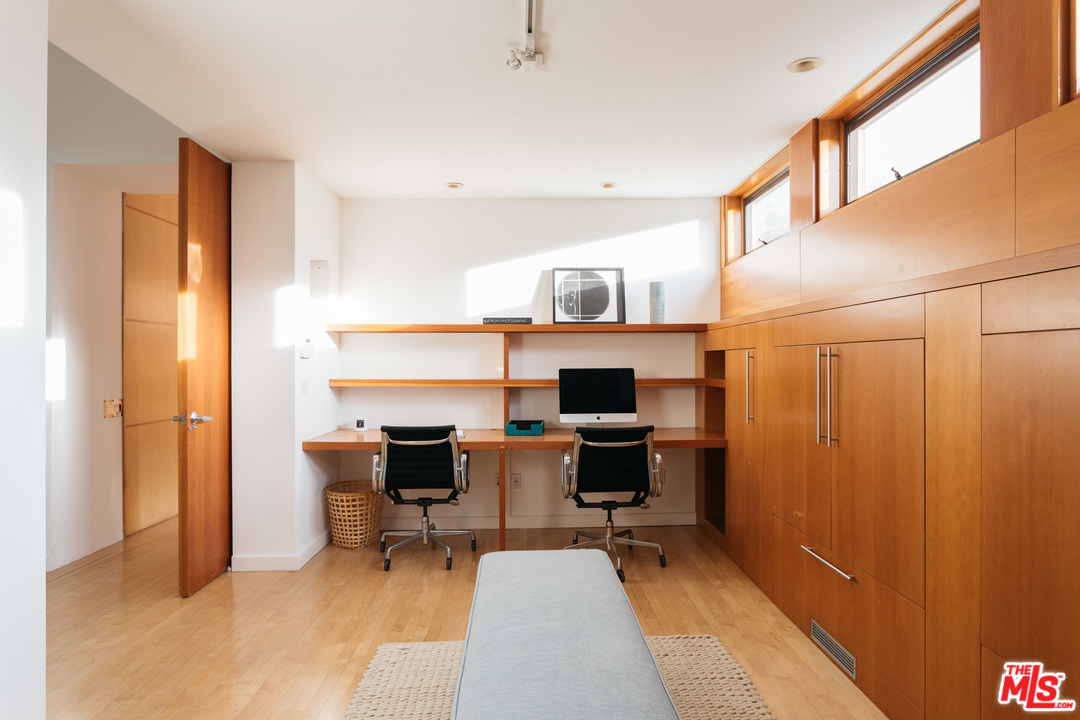 2244 Mandeville Canyon Road Los Angeles, CA 90049 - Photo 30 of 50 a workspace with furniture and a window