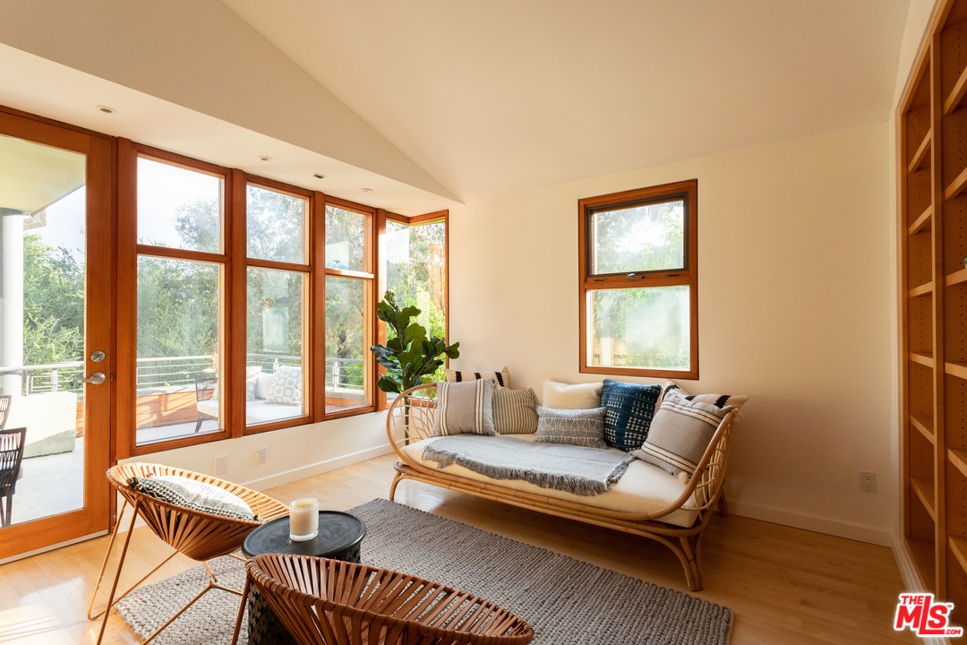 2244 Mandeville Canyon Road Los Angeles, CA 90049 - Photo 31 of 50 a living room with furniture and a window with outer view