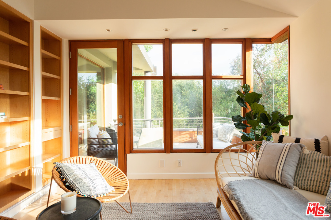 2244 Mandeville Canyon Road Los Angeles, CA 90049 - Photo 32 of 50 a living room with furniture and a large window