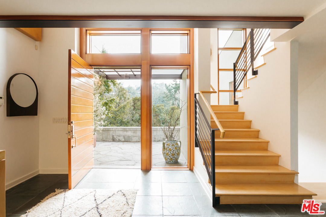 2244 Mandeville Canyon Road Los Angeles, CA 90049 - Photo 5 of 50 a view of entryway and hall with wooden floor