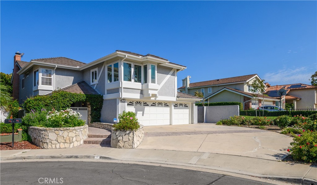 7 Jamestown Irvine, CA 92620 - Photo 2 of 7 a front view of a house with a yard