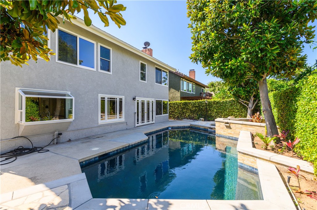 7 Jamestown Irvine, CA 92620 - Photo 6 of 7 a front view of a house with garden