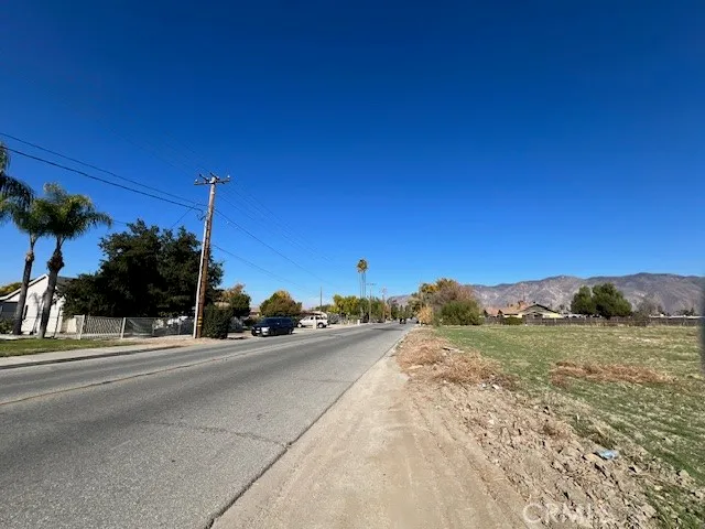 a view of a tennis ground with a large park