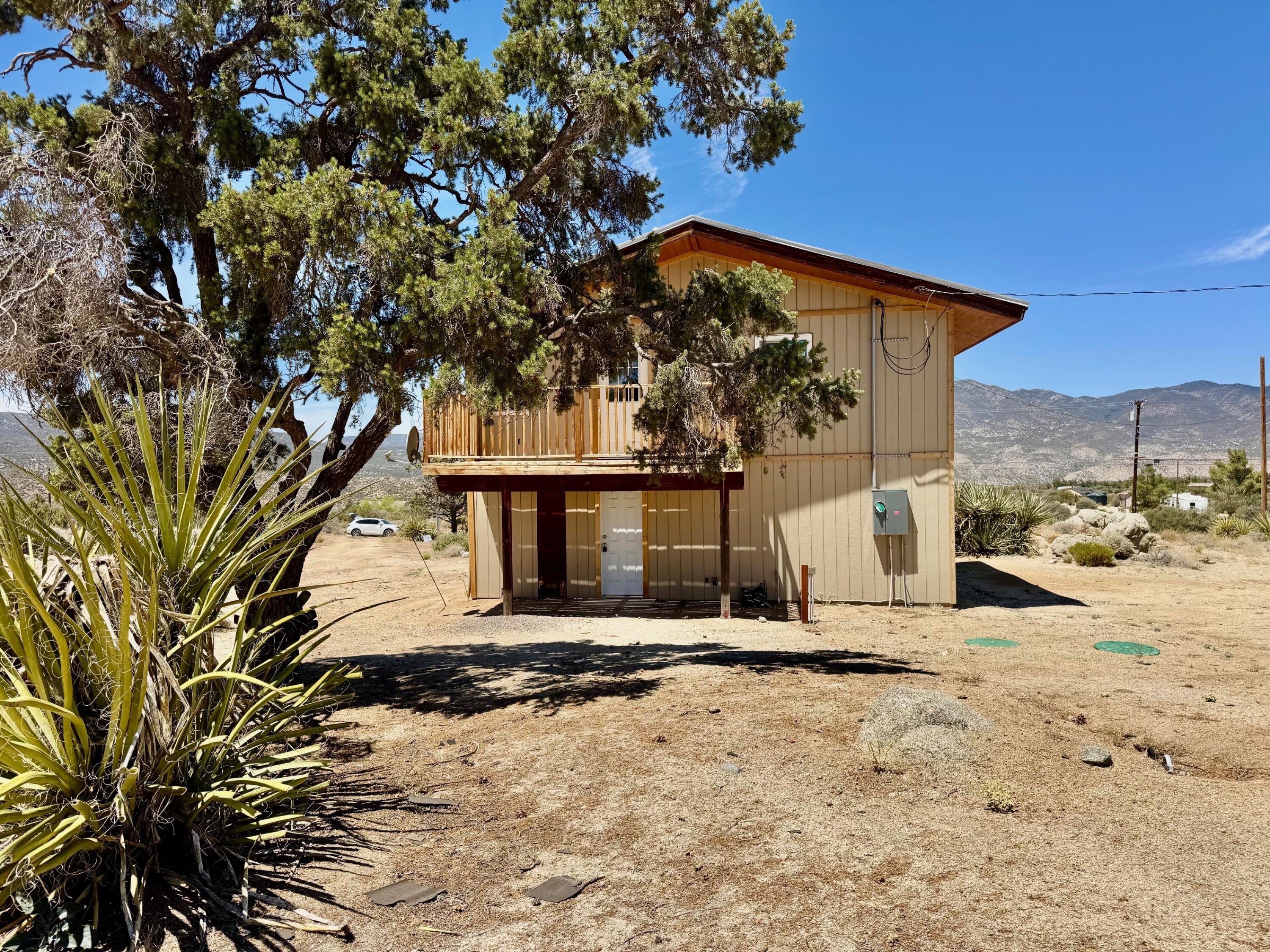 61550 Jeraboa Road Mountain Center, CA 92561 - Photo 3 of 13 a view of a house with a yard