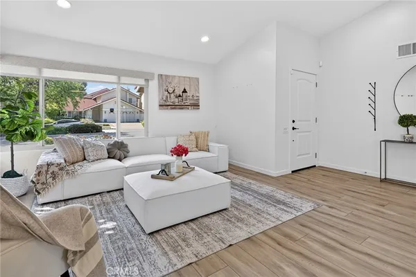 a kitchen with stainless steel appliances granite countertop a stove refrigerator sink and cabinets