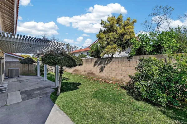 a view of an house with swimming pool and sitting area