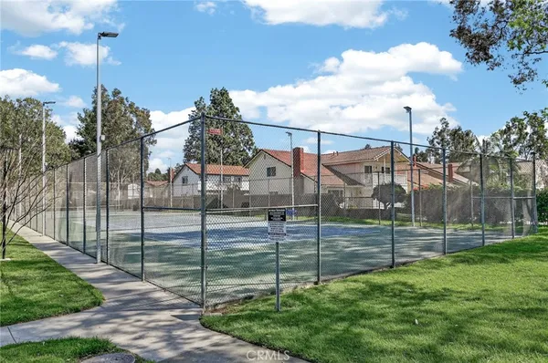 a view of a lake with houses in the background