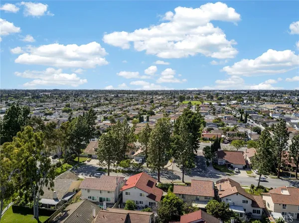 a view of a park with swings and slides