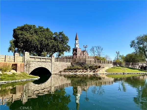 an aerial view of a house with a yard and potted plants