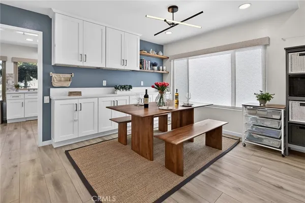 a living room with furniture wooden floor and a flat screen tv