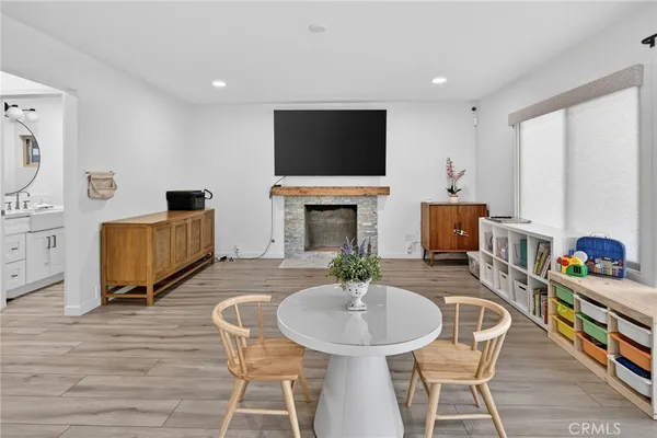 a kitchen with a sink stainless steel appliances and white cabinets