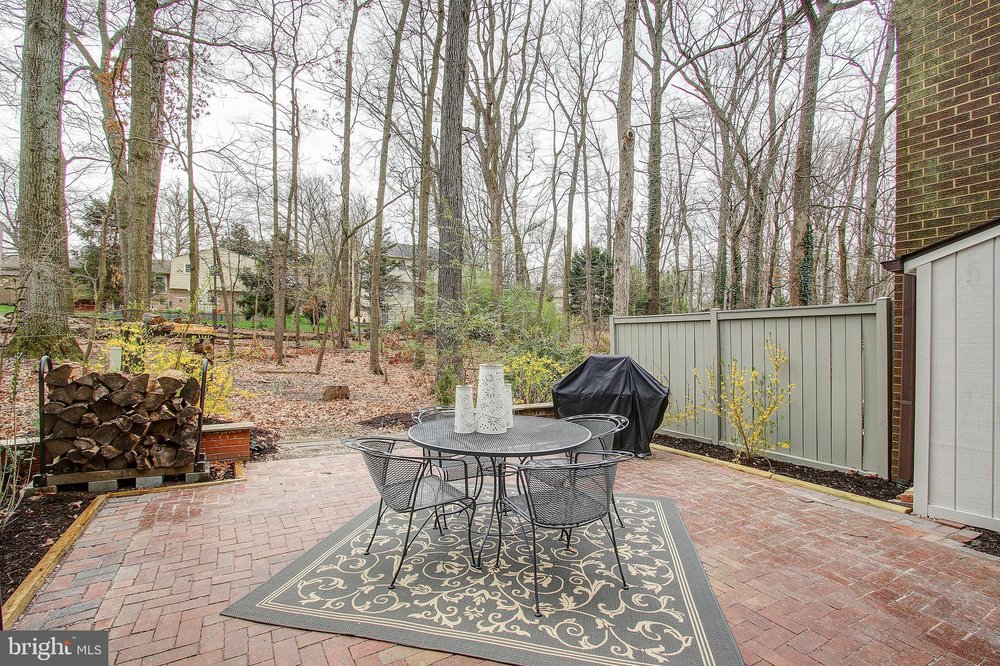 12011 Insha Court Reston, VA 20191 - Photo 32 of 33 Brick Patio overlooks wooded yard