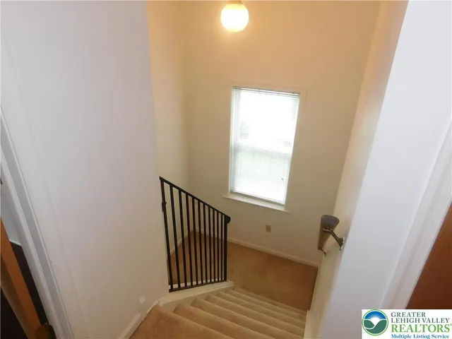 a view of a hallway with a window