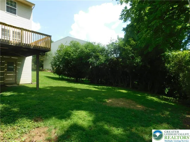 a view of an entrance to house with yard