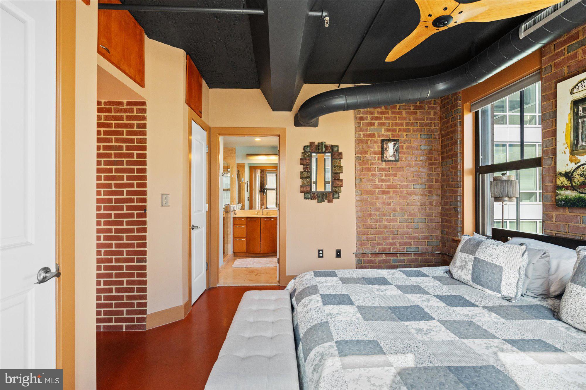 916 G St. Northwest, Unit 803 Washington, DC 20001 - Photo 17 of 27 a bedroom with furniture and large windows