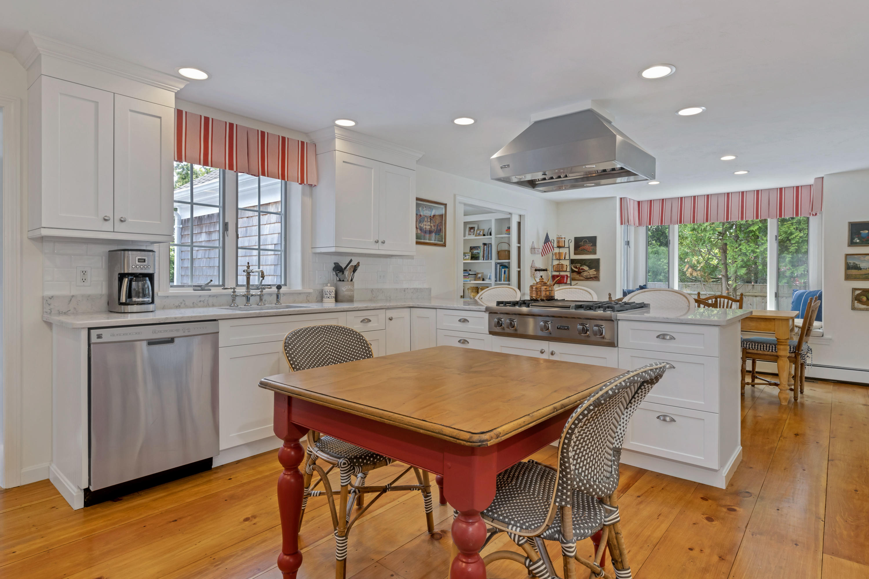 88 Round Cove Road Chatham, MA 02633 - Photo 13 of 58 a kitchen with a table chairs sink and cabinets