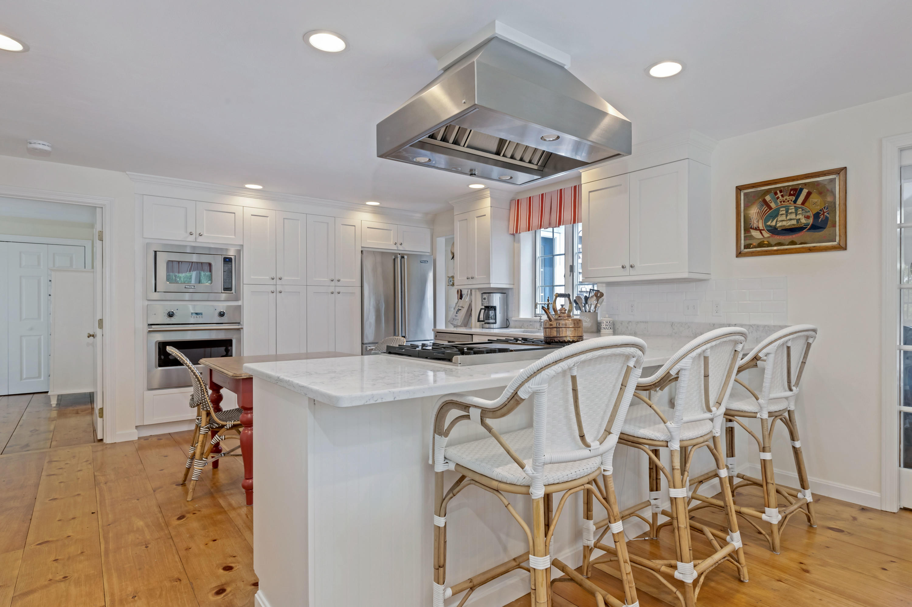 88 Round Cove Road Chatham, MA 02633 - Photo 14 of 58 a view of a dining room with furniture and a chandelier