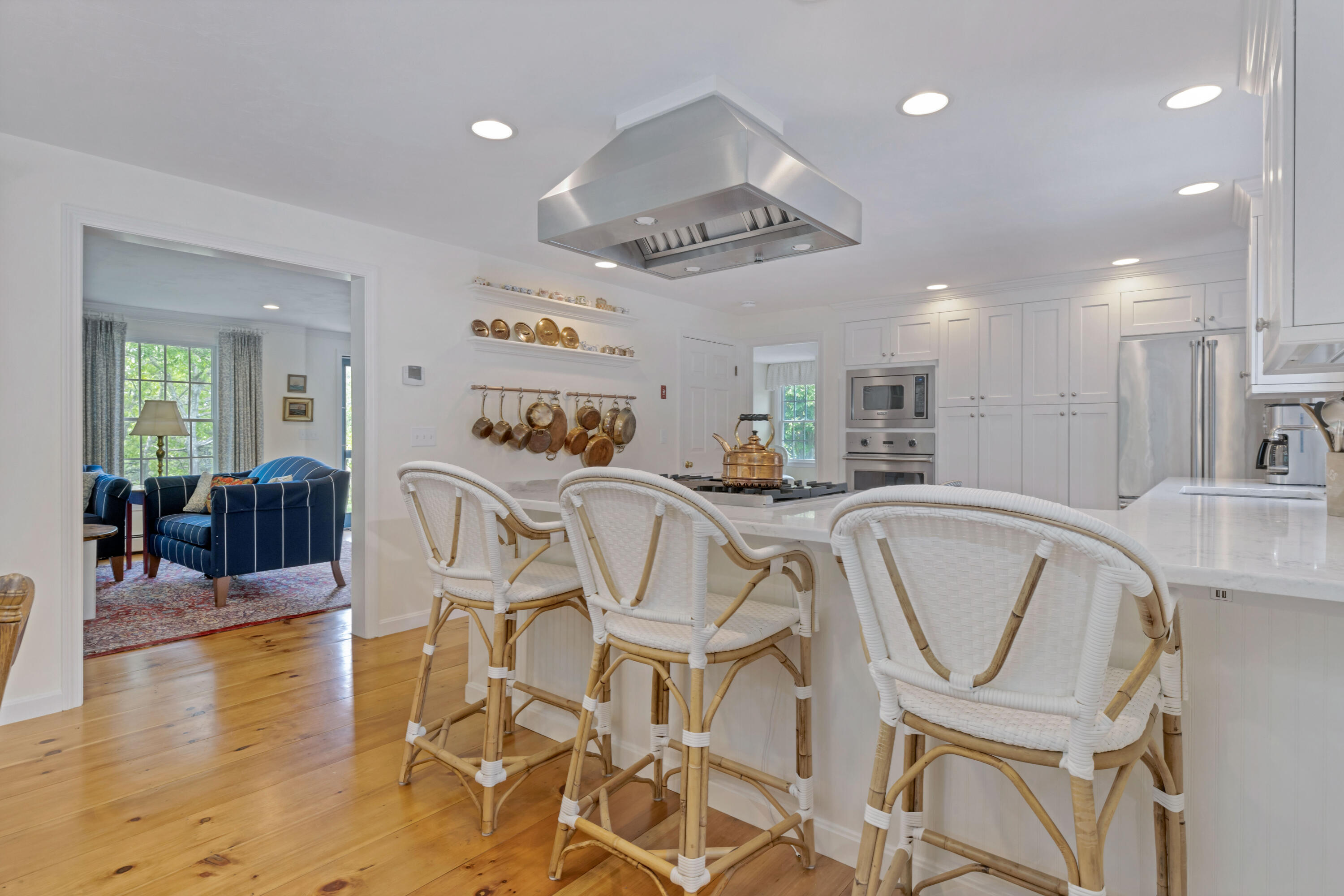 88 Round Cove Road Chatham, MA 02633 - Photo 15 of 58 a view of a dining room kitchen with furniture and wooden floor