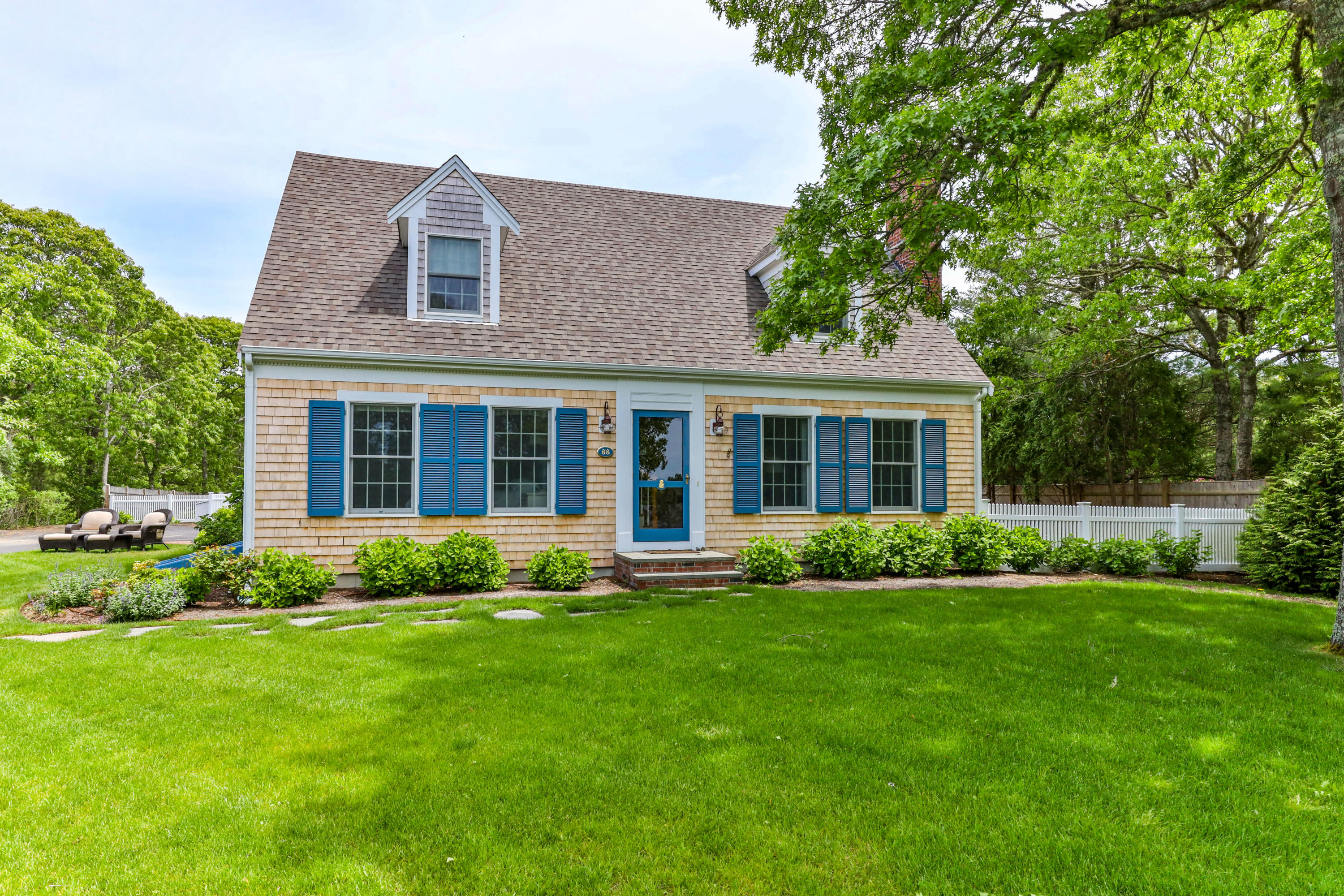 88 Round Cove Road Chatham, MA 02633 - Photo 2 of 58 a view of a house with a yard and plants