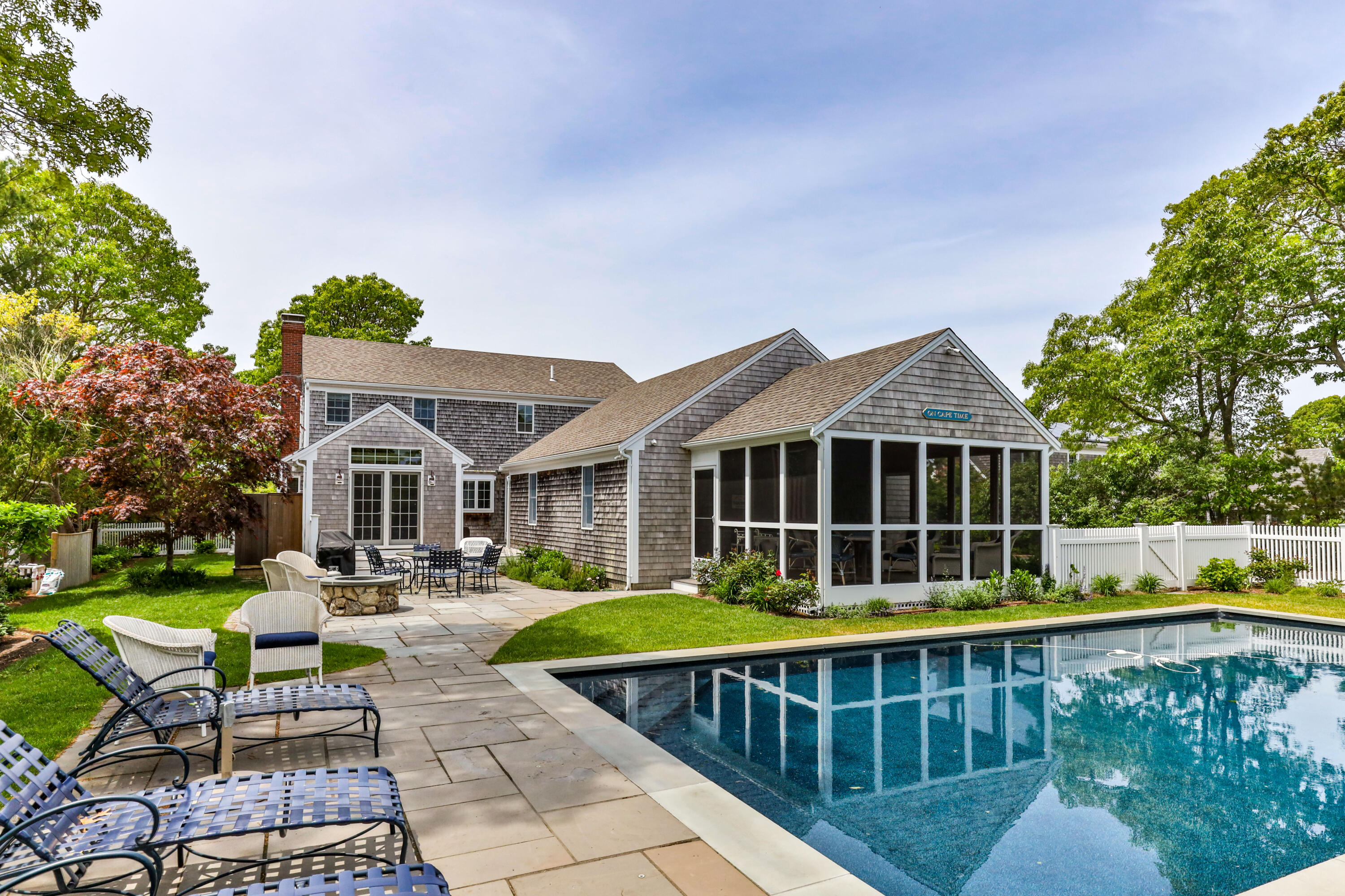 88 Round Cove Road Chatham, MA 02633 - Photo 25 of 58 a view of a house with swimming pool and sitting area