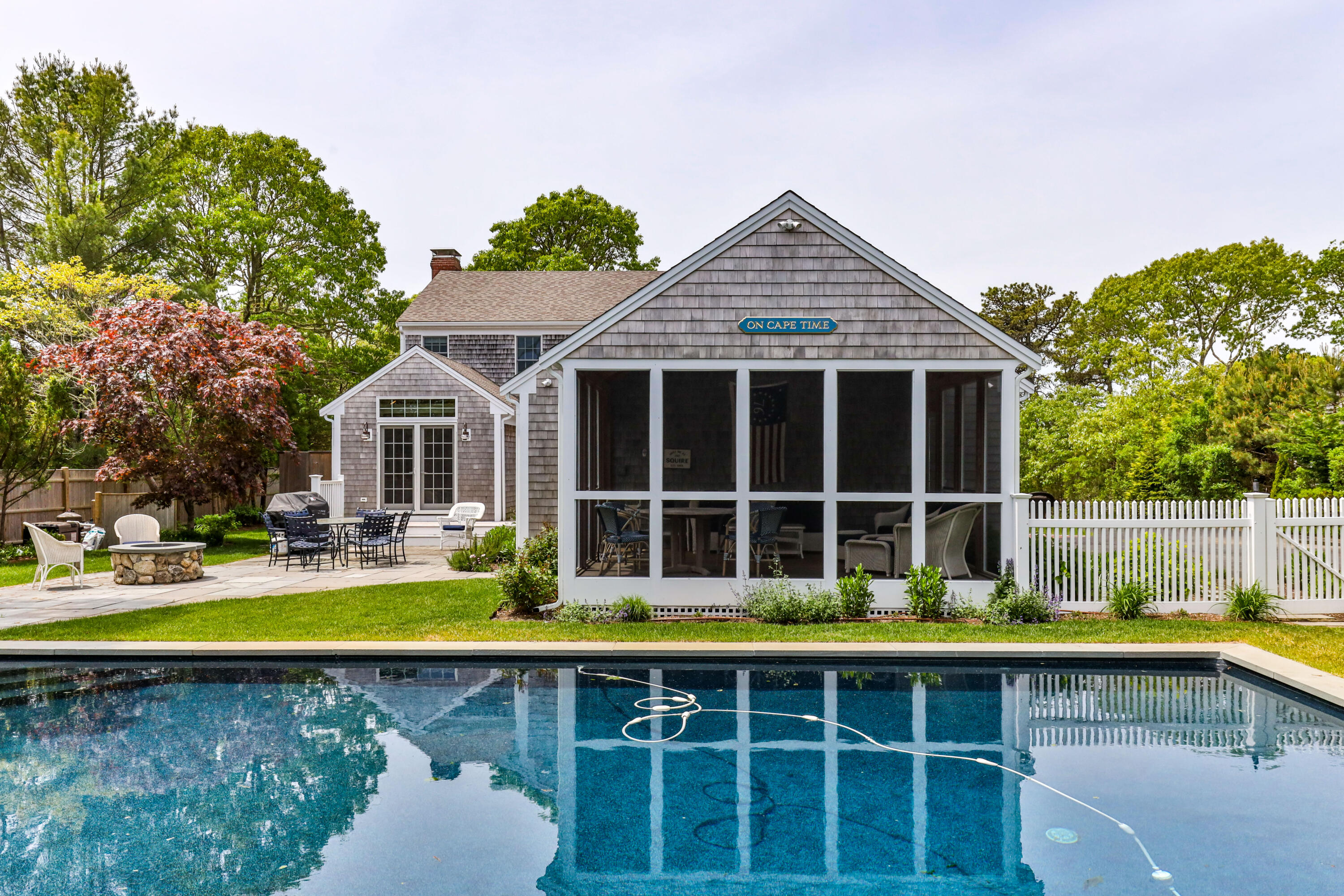 88 Round Cove Road Chatham, MA 02633 - Photo 27 of 58 a view of a house with pool and chairs