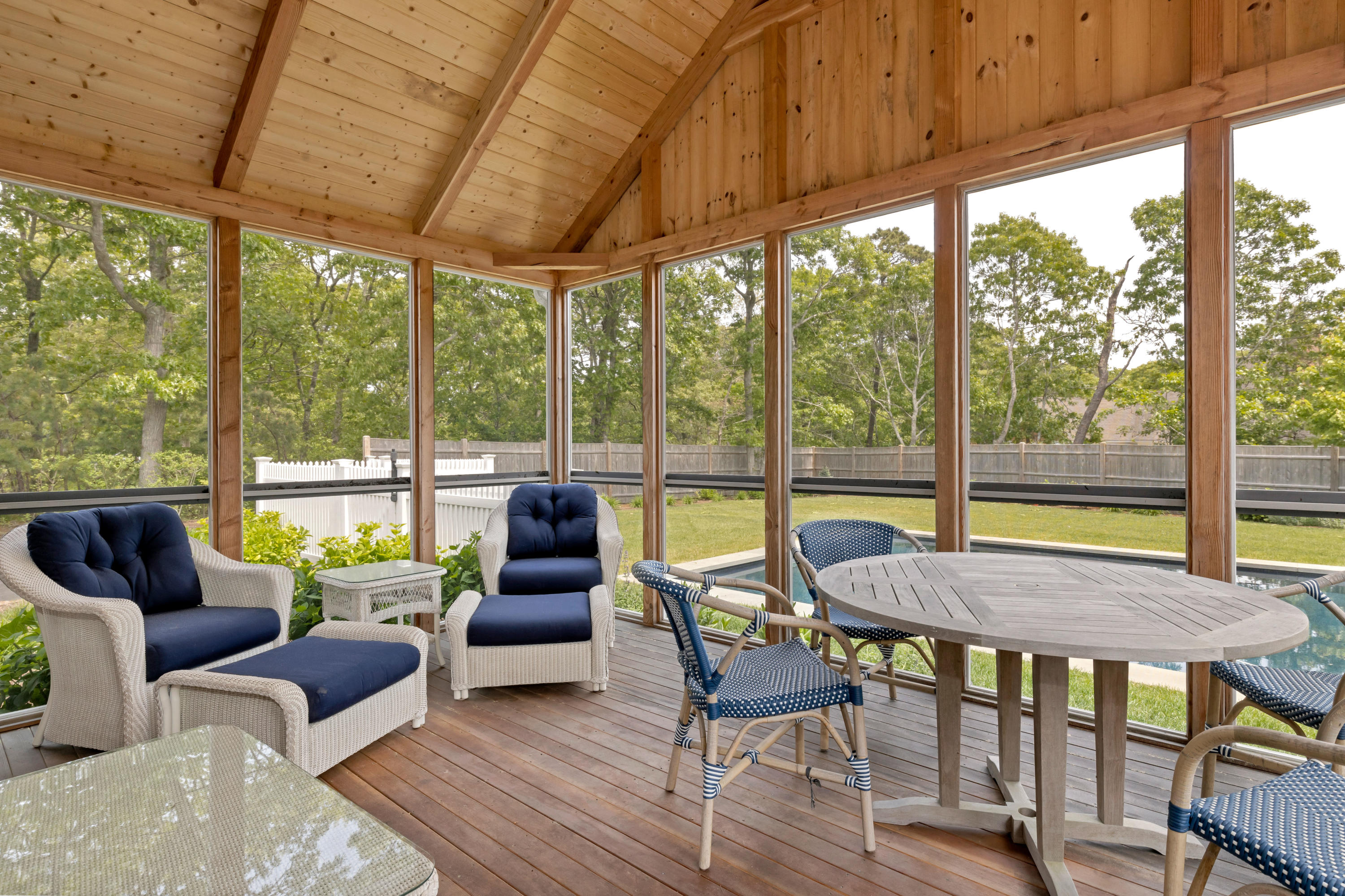 88 Round Cove Road Chatham, MA 02633 - Photo 30 of 58 a living room with furniture and a floor to ceiling window
