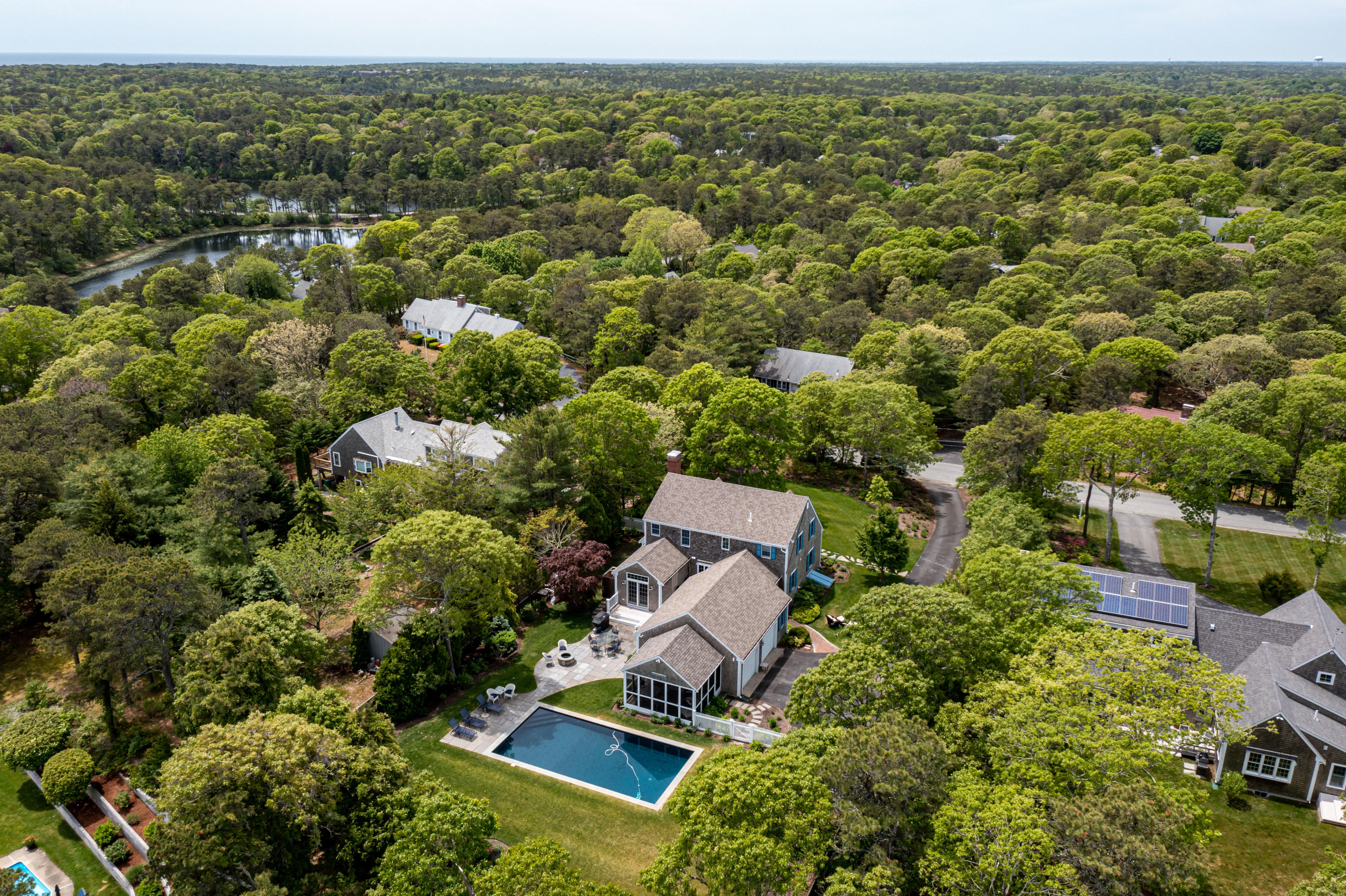 88 Round Cove Road Chatham, MA 02633 - Photo 3 of 58 an aerial view of a house with a yard