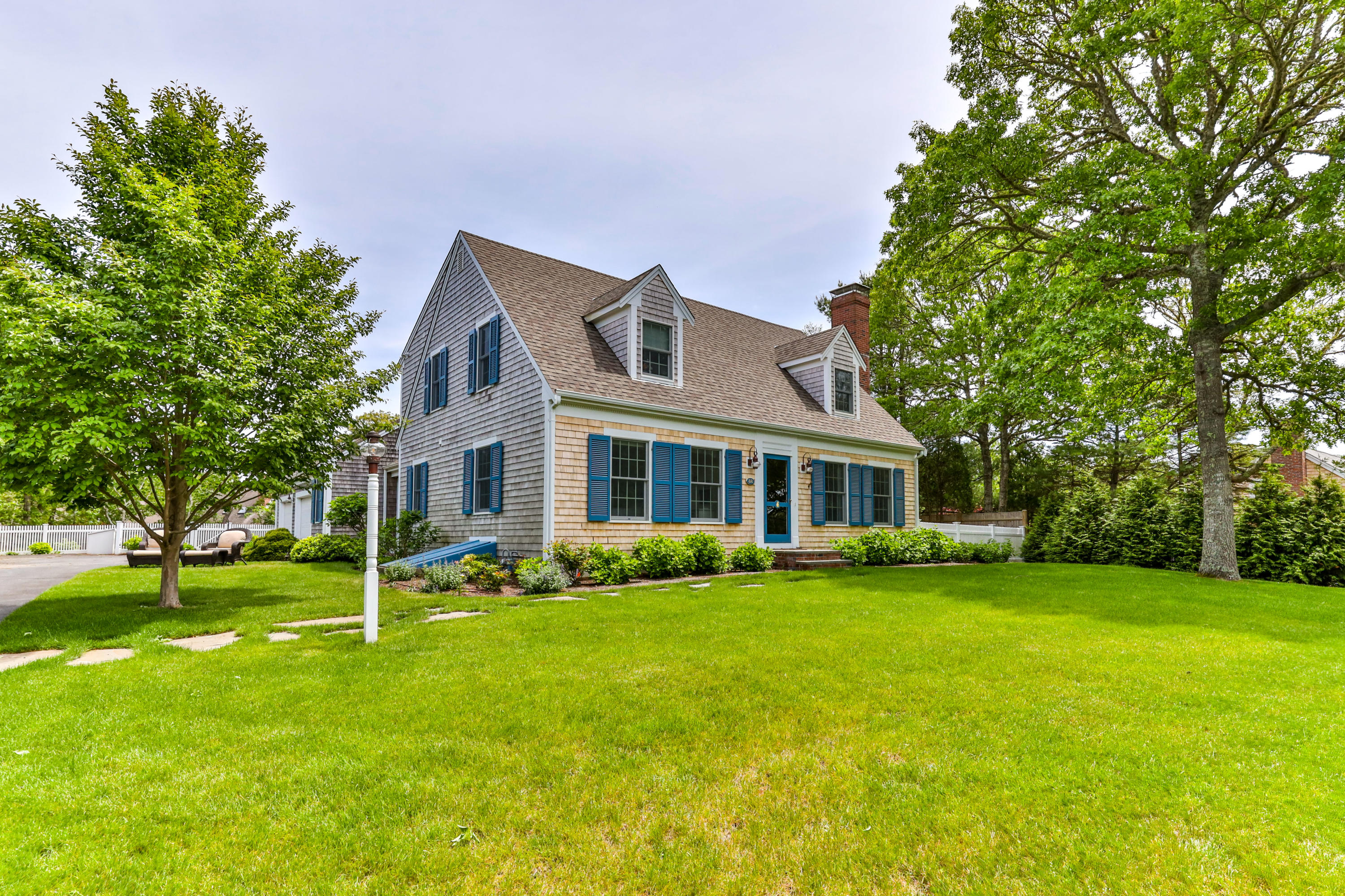 88 Round Cove Road Chatham, MA 02633 - Photo 55 of 58 a front view of a house with a garden