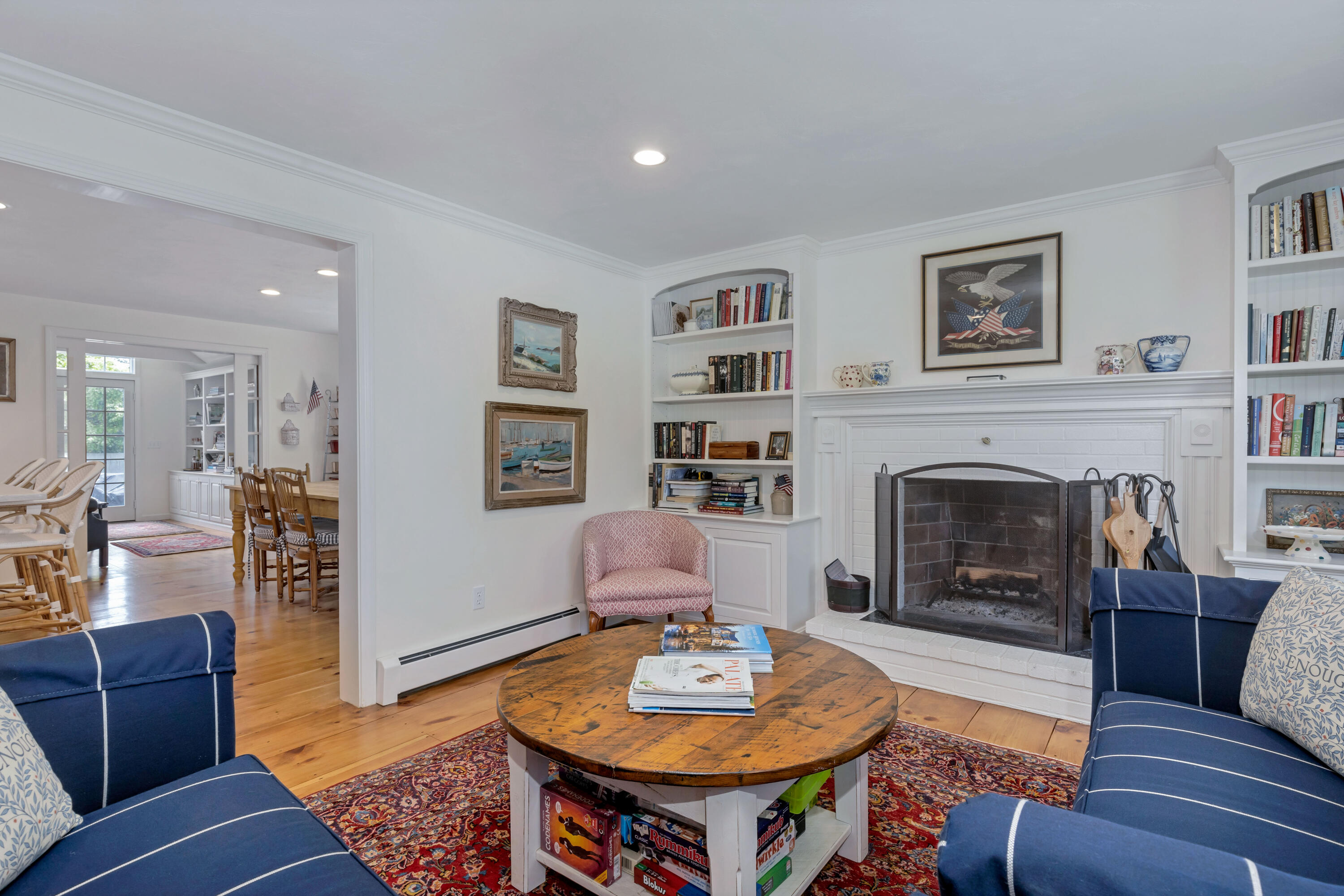 88 Round Cove Road Chatham, MA 02633 - Photo 7 of 58 a living room with furniture and a fireplace