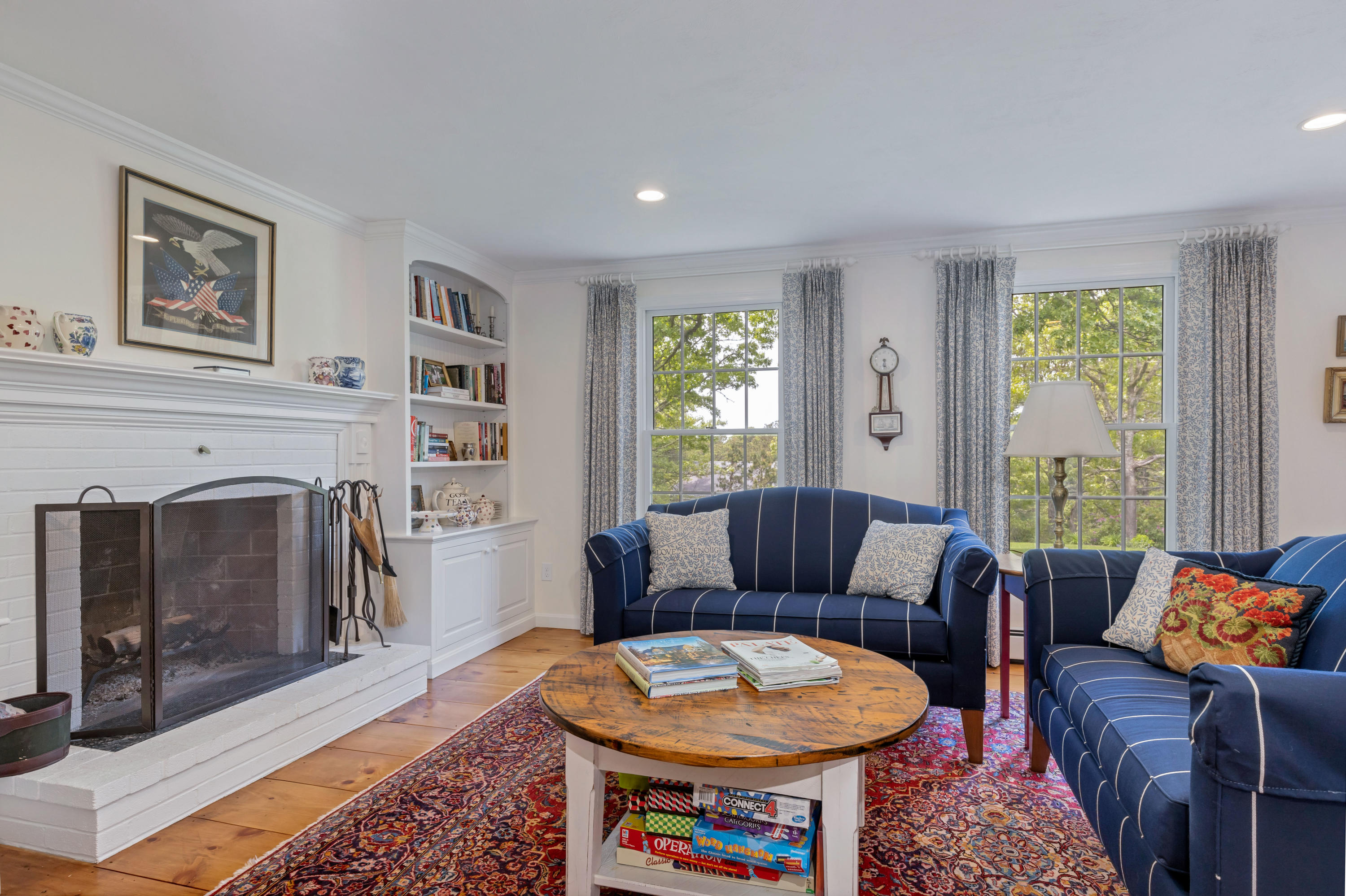 88 Round Cove Road Chatham, MA 02633 - Photo 8 of 58 a living room with furniture and a fireplace