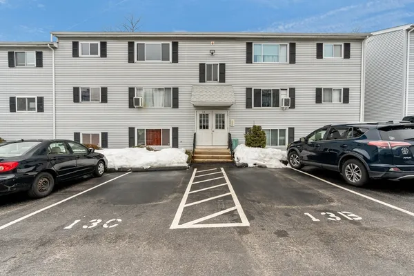 a view of a car park in front of a building