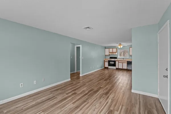 a view of kitchen and wooden floor
