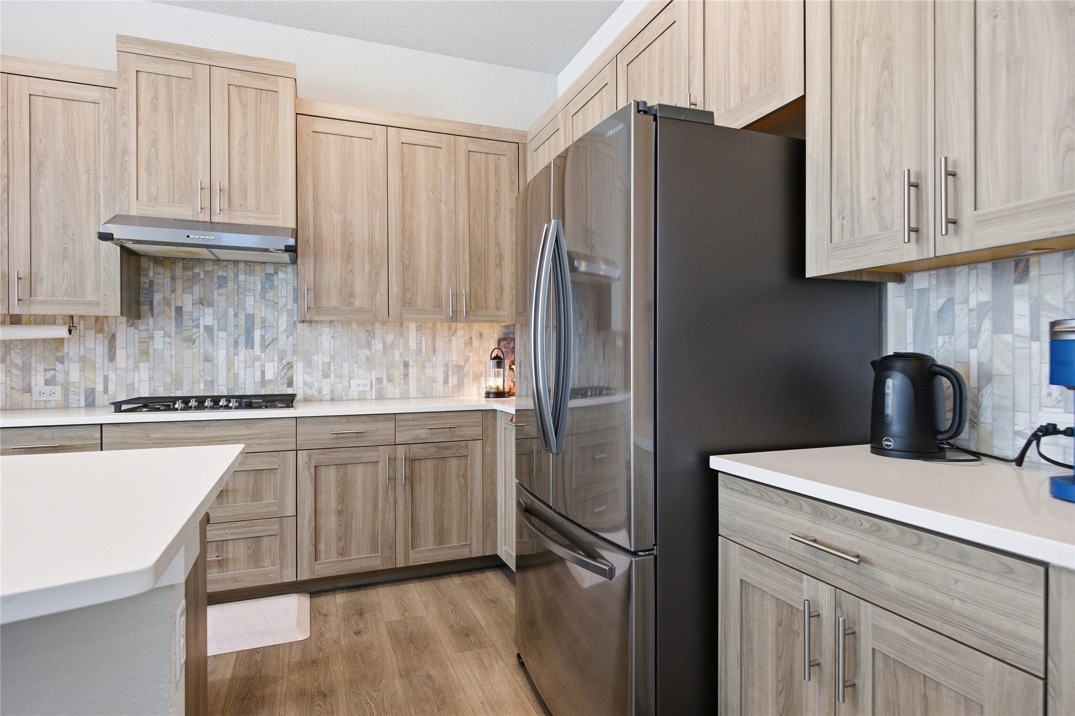 1008 Summer Glen Georgetown, TX 78628 - Photo 14 of 34 a kitchen with stainless steel appliances granite countertop a refrigerator sink and cabinets