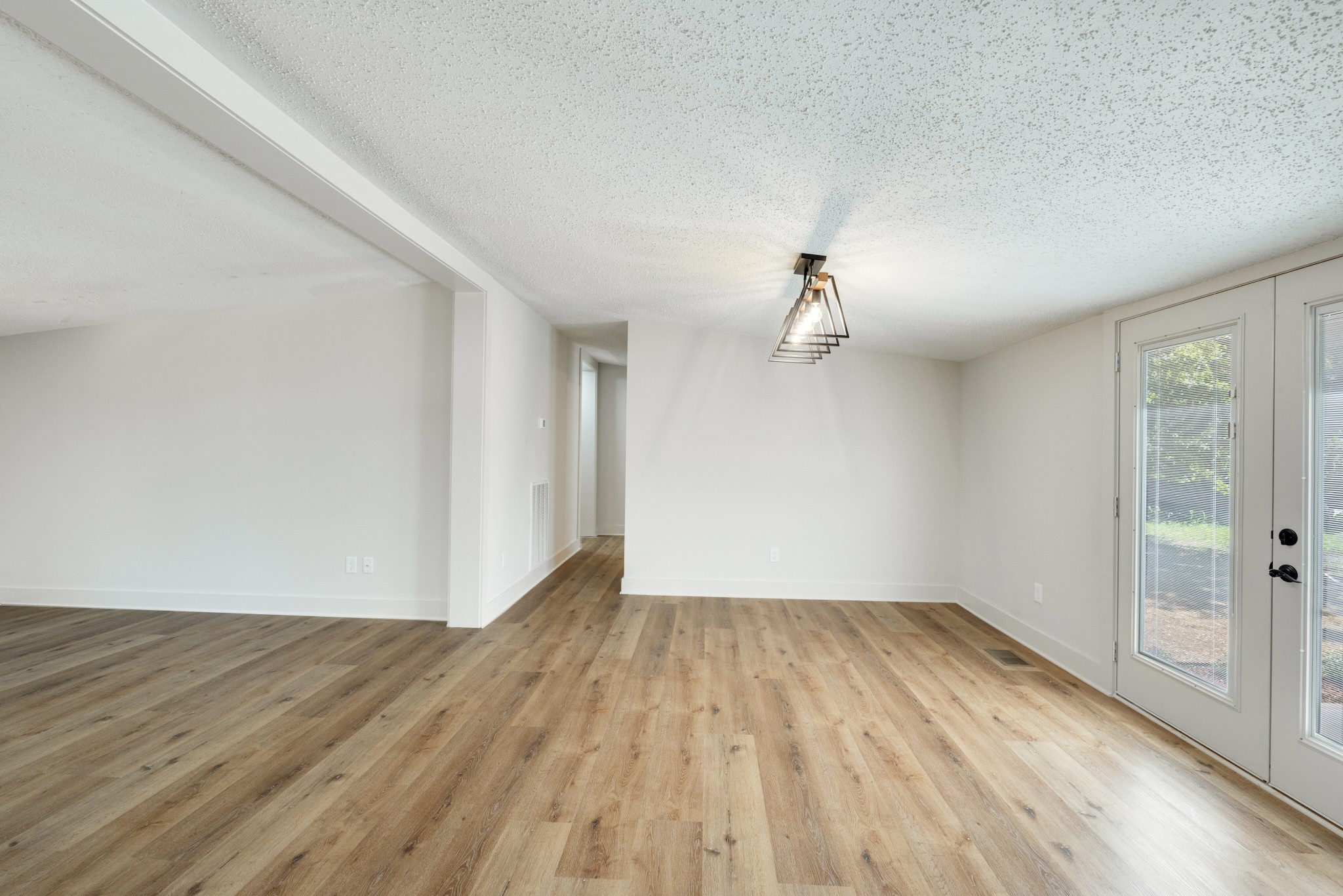9064 New Chapel Road Springfield, TN 37172 - Photo 11 of 33 wooden floor in an empty room with a window