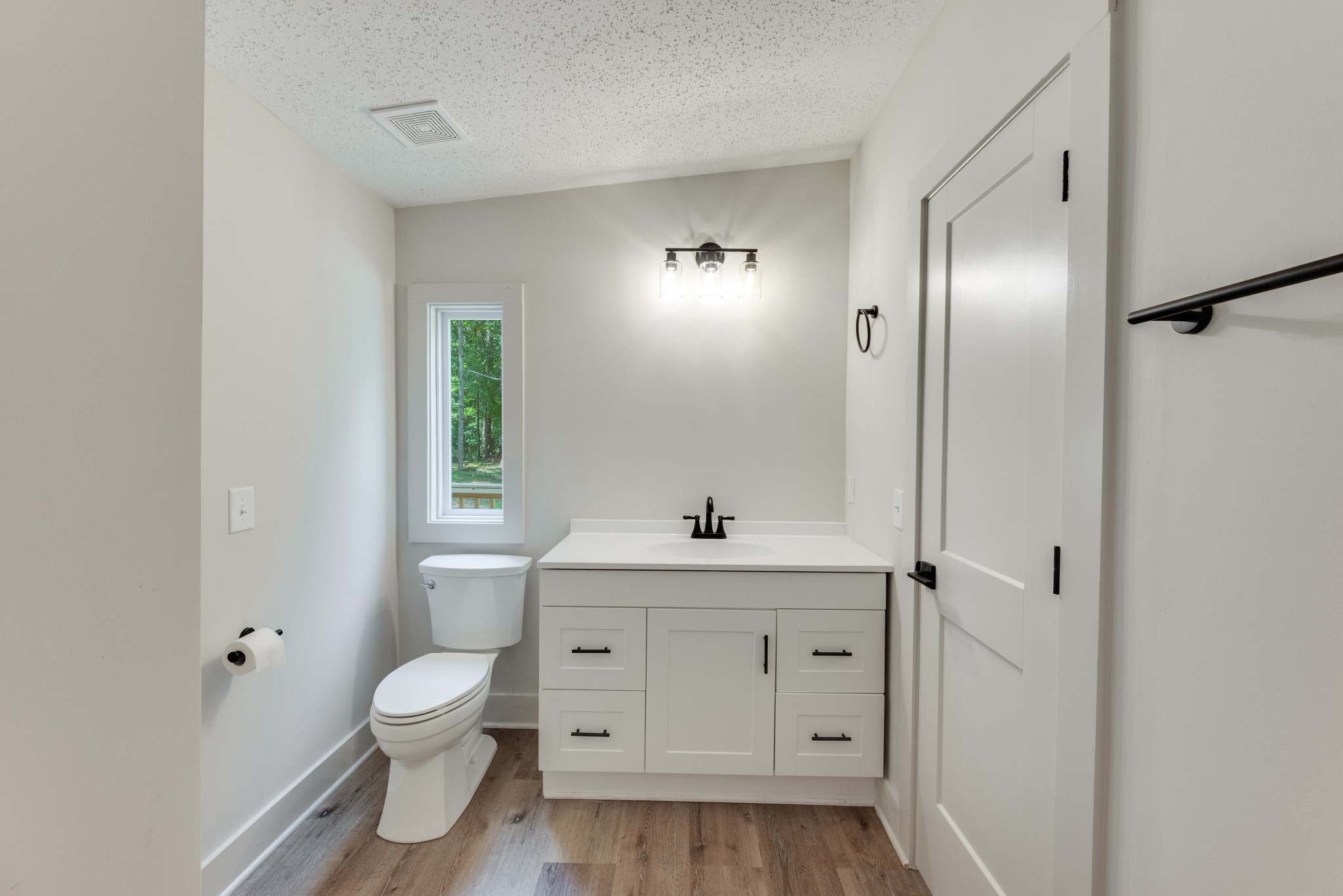 9064 New Chapel Road Springfield, TN 37172 - Photo 21 of 33 a bathroom with a sink a toilet and a mirror