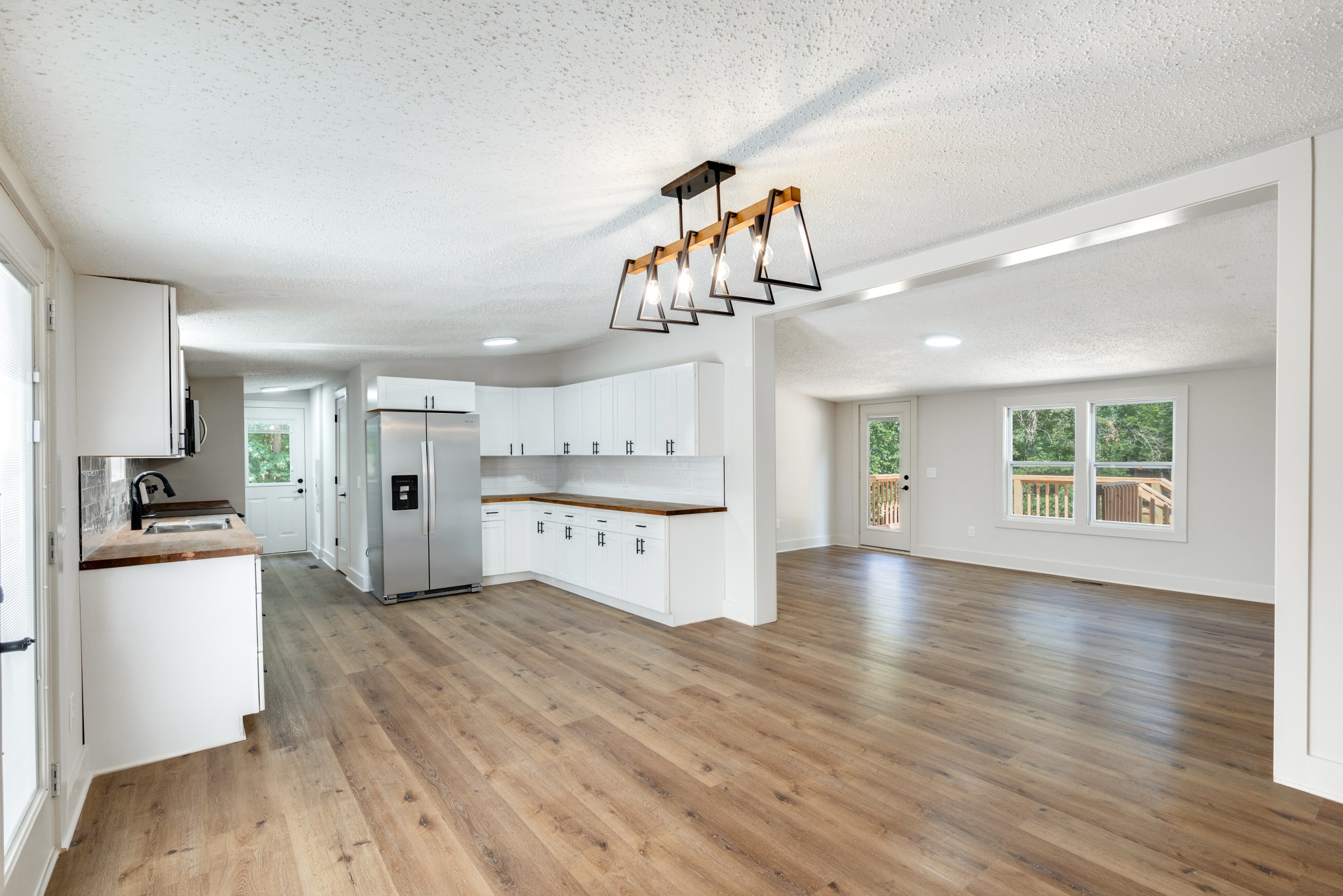 9064 New Chapel Road Springfield, TN 37172 - Photo 5 of 33 a view of a kitchen cabinets and wooden floor