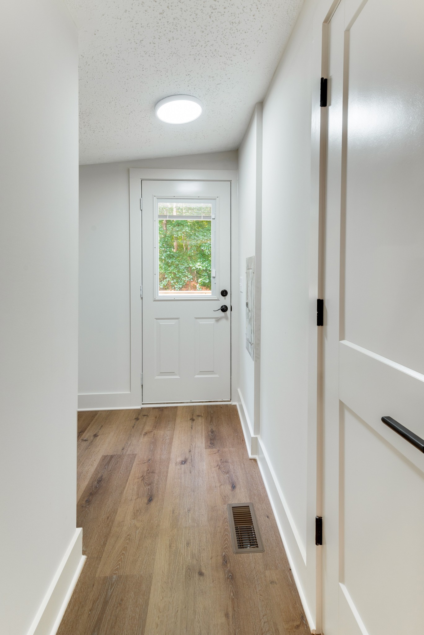 9064 New Chapel Road Springfield, TN 37172 - Photo 9 of 33 a view of a hallway with wooden floor