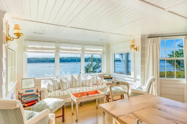 a view of a dining room with furniture wooden floor and chandelier
