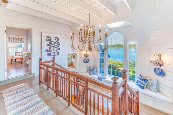 a bedroom with a bed and glass window