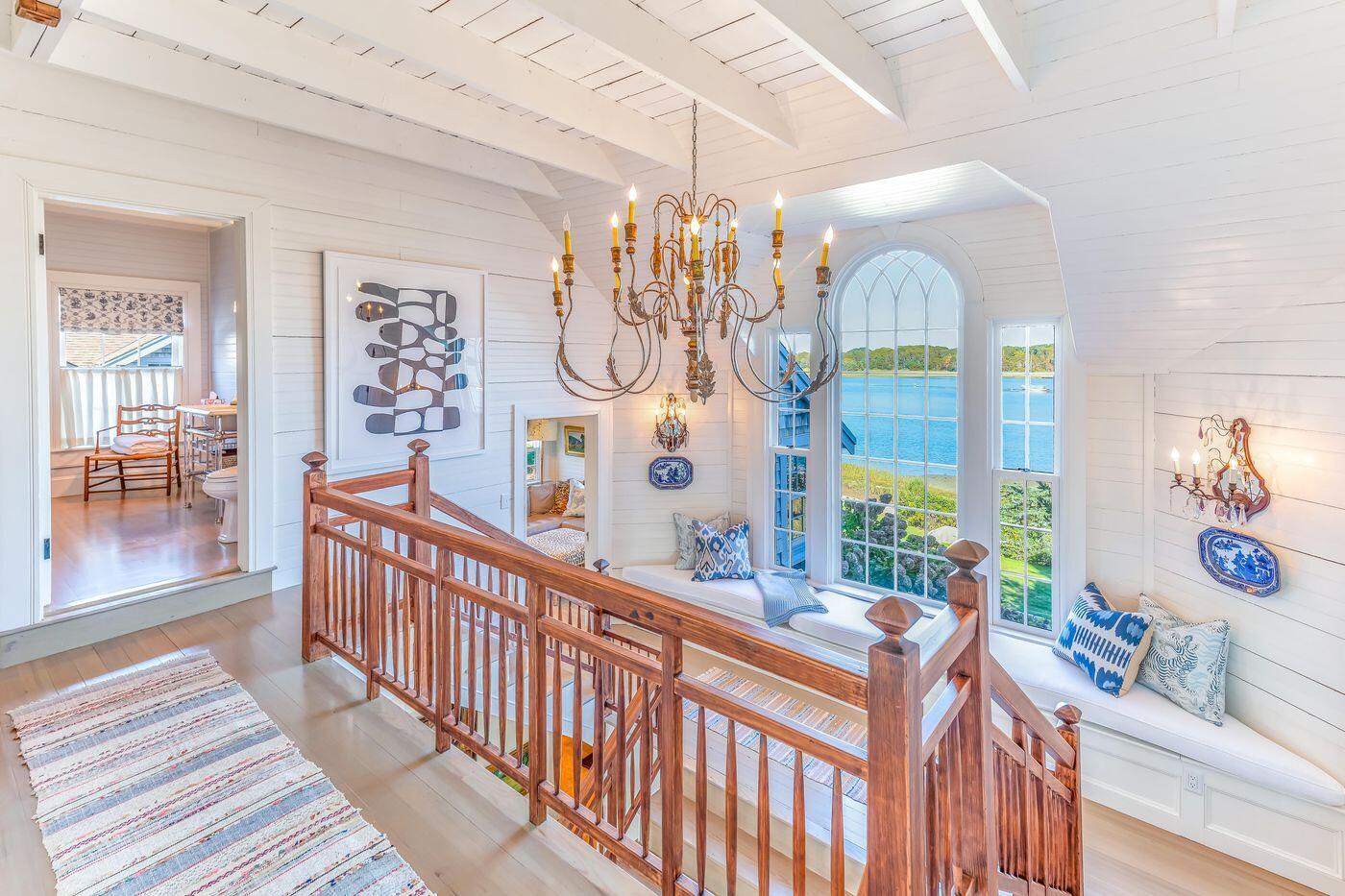 75 Winsor Road Cataumet, MA 02534 - Photo 14 of 27 a view of a dining room with furniture chandelier and wooden floor